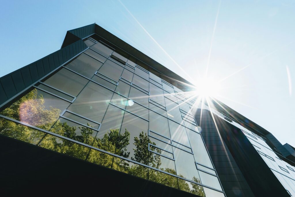 Office building with reflective glass windows for commercial solar control window tinting