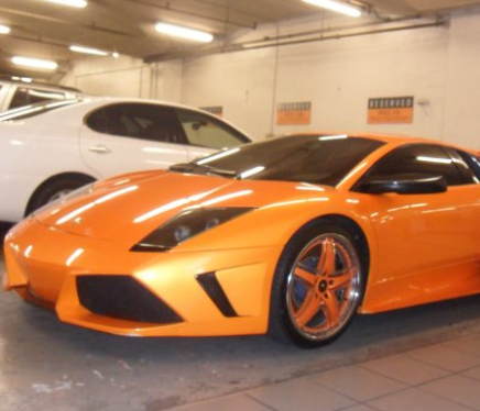 Tesla receiving paint protection treatment in Marina Del Rey shop