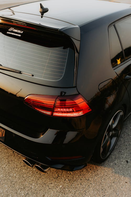 Rear view of a black Golf car featuring ceramic window tinting.