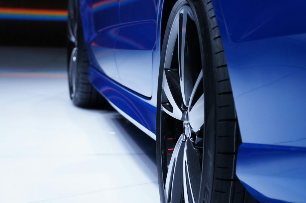 Blue car using car paint protection film installation services