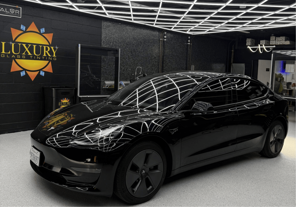 A ceramic window tint to a side window of a luxury car.