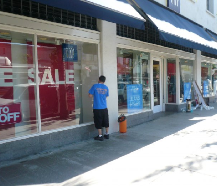 Exterior view of a large retail store with reflective commercial window tint applied