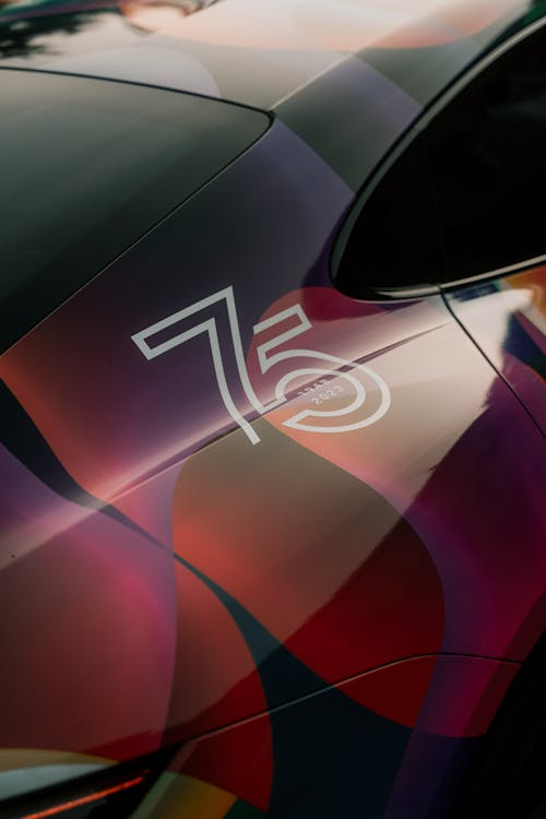 A car featuring a detailed custom vinyl wrap design.