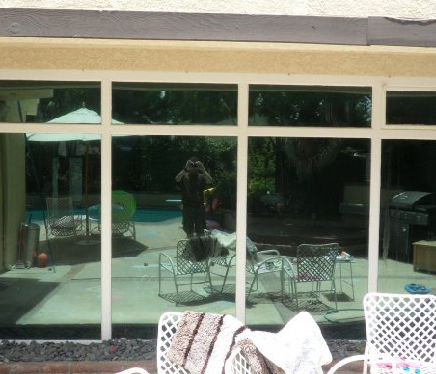 Decorative window tinting on a large window with patterned glass film.