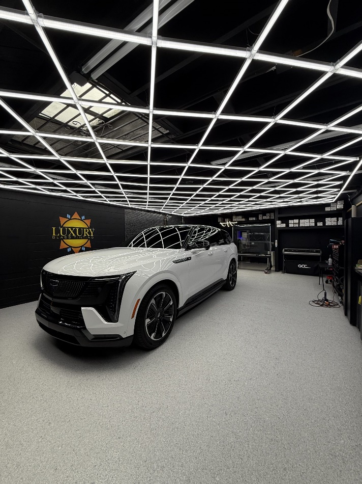 A luxury car after a successful paint protection film process.