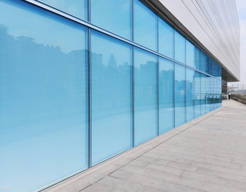 Glass panels of a commercial building tinted to create a comfortable workspace and protect interiors