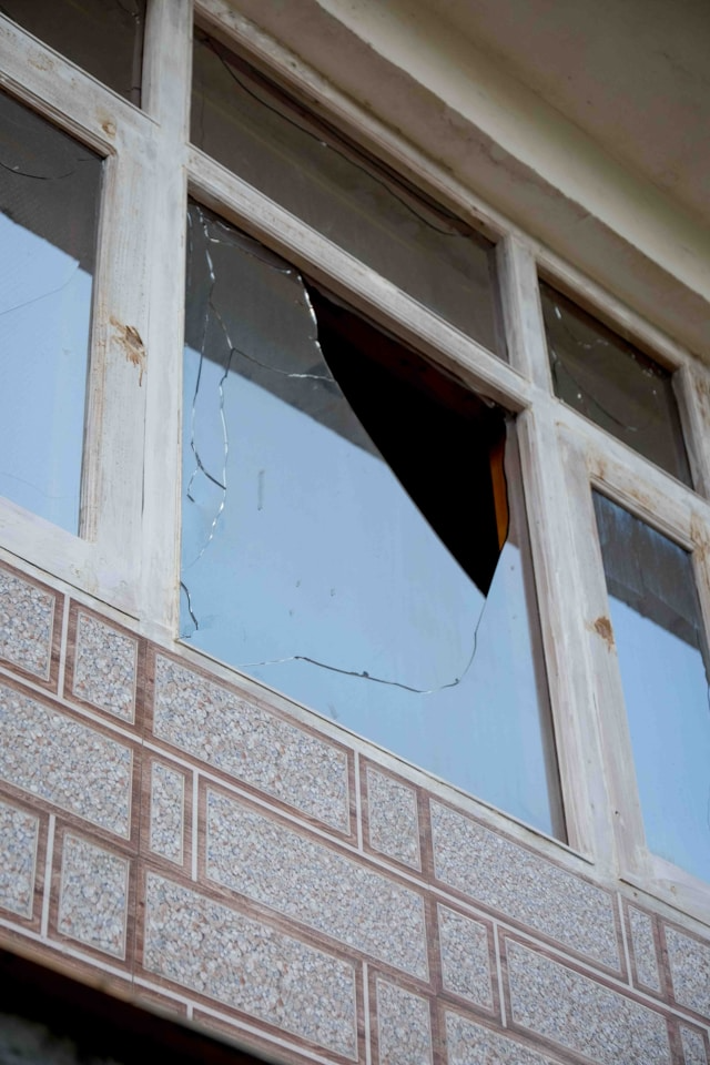 This photo shows a shattered office window