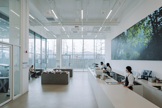 This photo shows a modern office with large windows