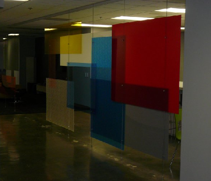 Decorative glass film applied to an office partition to improve aesthetics and workplace productivity.