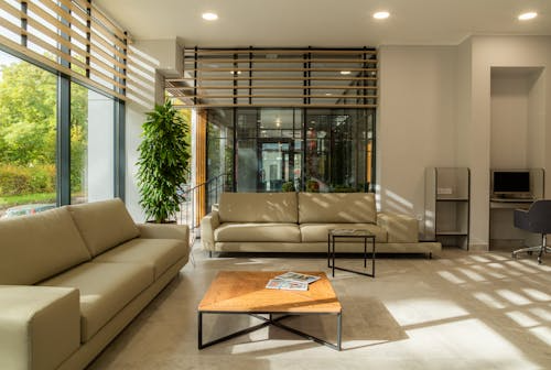 Sunlight streaming through a Los Angeles home window onto furniture and flooring