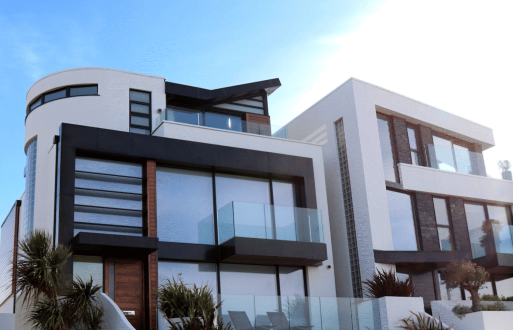 A modern residential house in Culver City featuring large windows with professional solar-control window tinting applied.