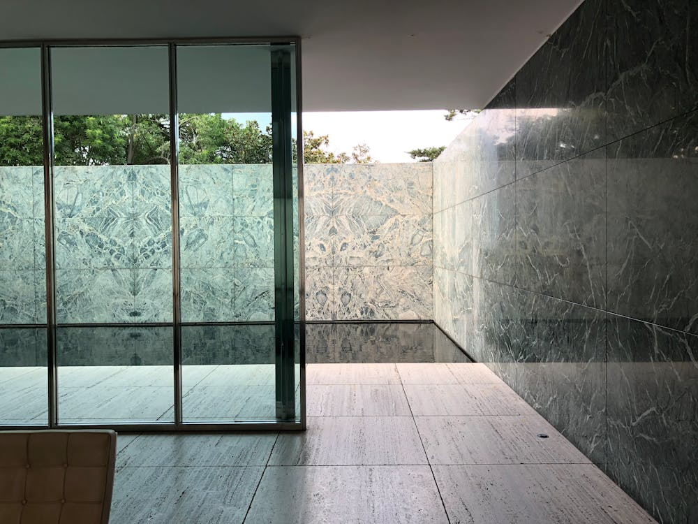 Entrance of a luxury home with large tinted windows, combining privacy and modern style