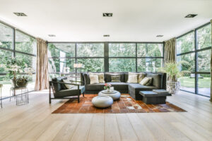 living room home solar window film large glass windows Bright living room with large glass windows fitted with home solar window film