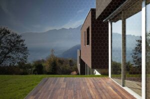 residential solar control window film modern house exterior Modern house exterior with residential solar control window film on large glass doors