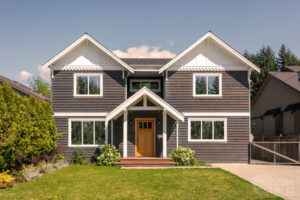 residential solar window tint modern family home Modern family home with residential solar window tint installed on front-facing windows.