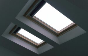 Two ceiling skylights with window film in a modern home interior