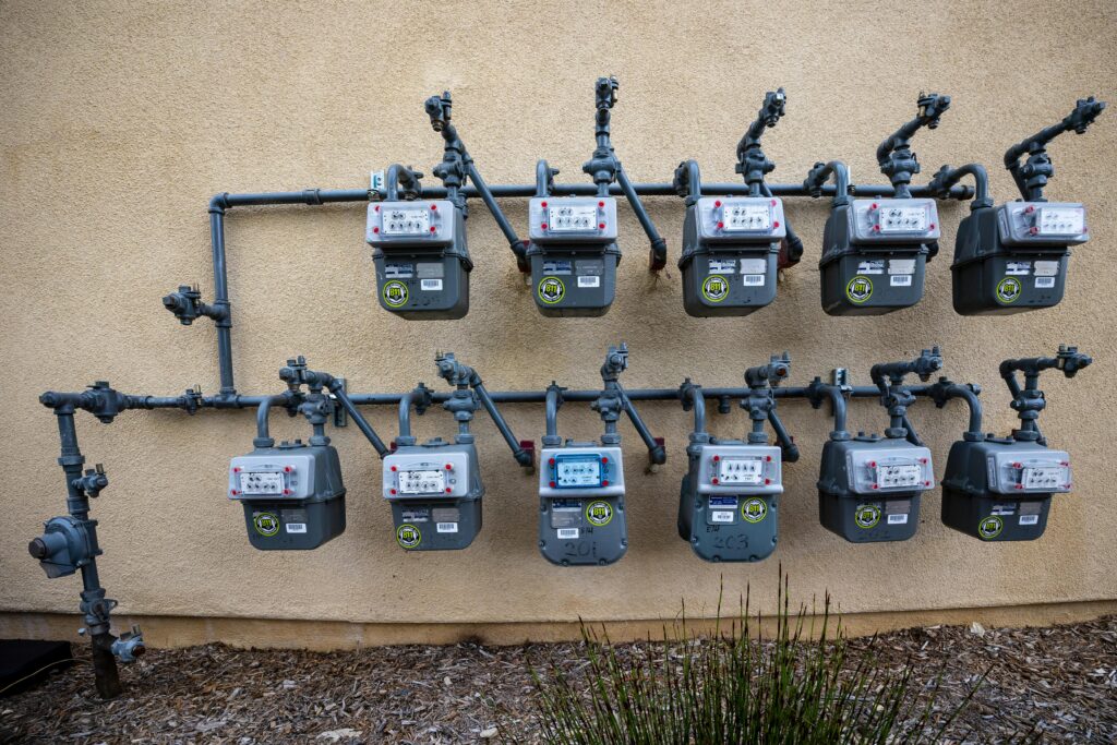 Residential utility meters mounted on an exterior wall