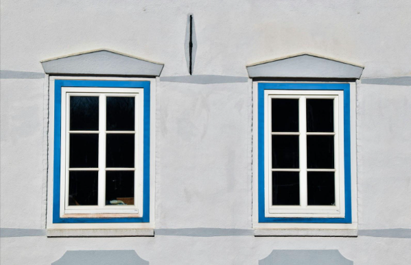 Traditional home exterior with household window tint on two front-facing windows