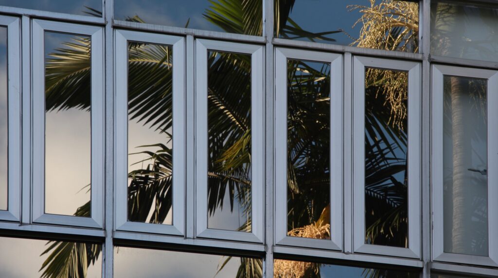 Commercial building facade with reflective window film